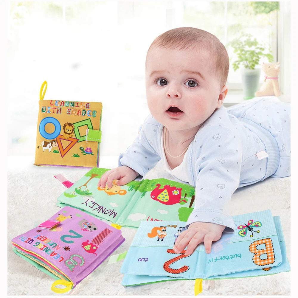 Baby interacting with colorful educational books on a light surface.
