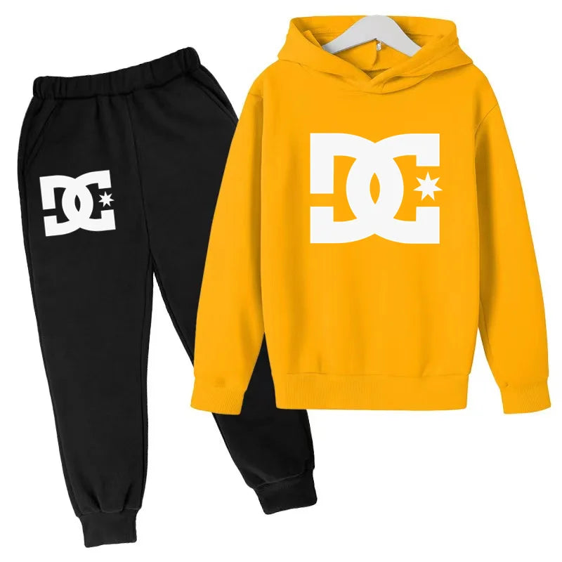 Yellow hoodie and black pants with DC logo on a white background