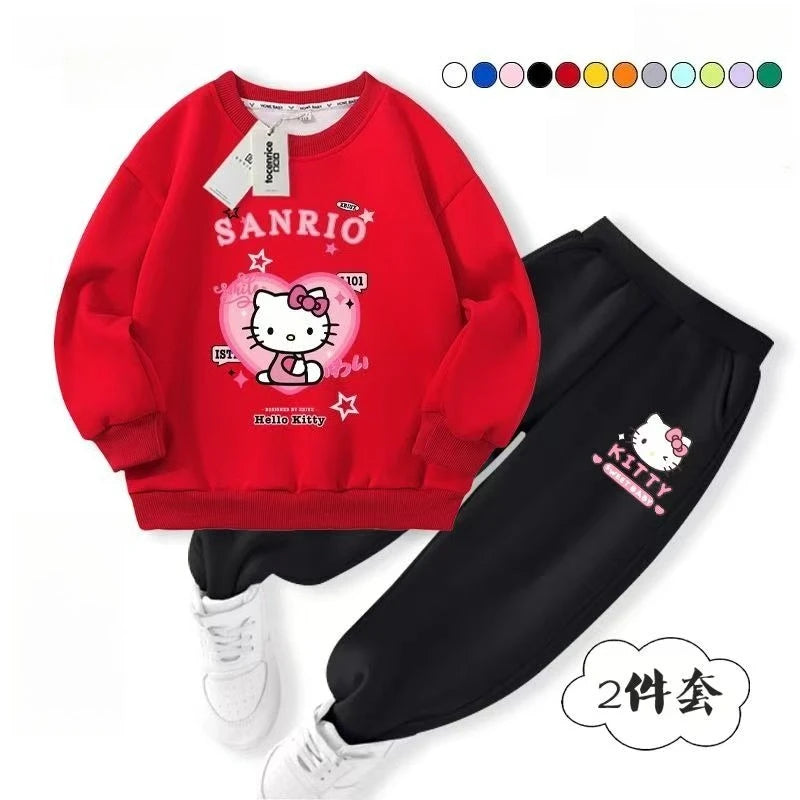 Red Sanrio sweatshirt and black pants with white sneakers on a white background