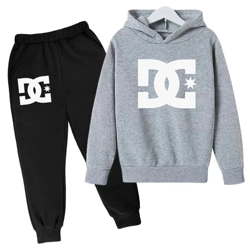 Gray hoodie and black pants with DC logo on a white background