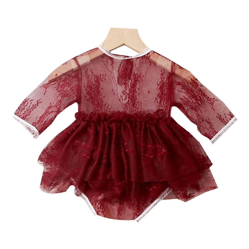 Red lace baby romper on a white background