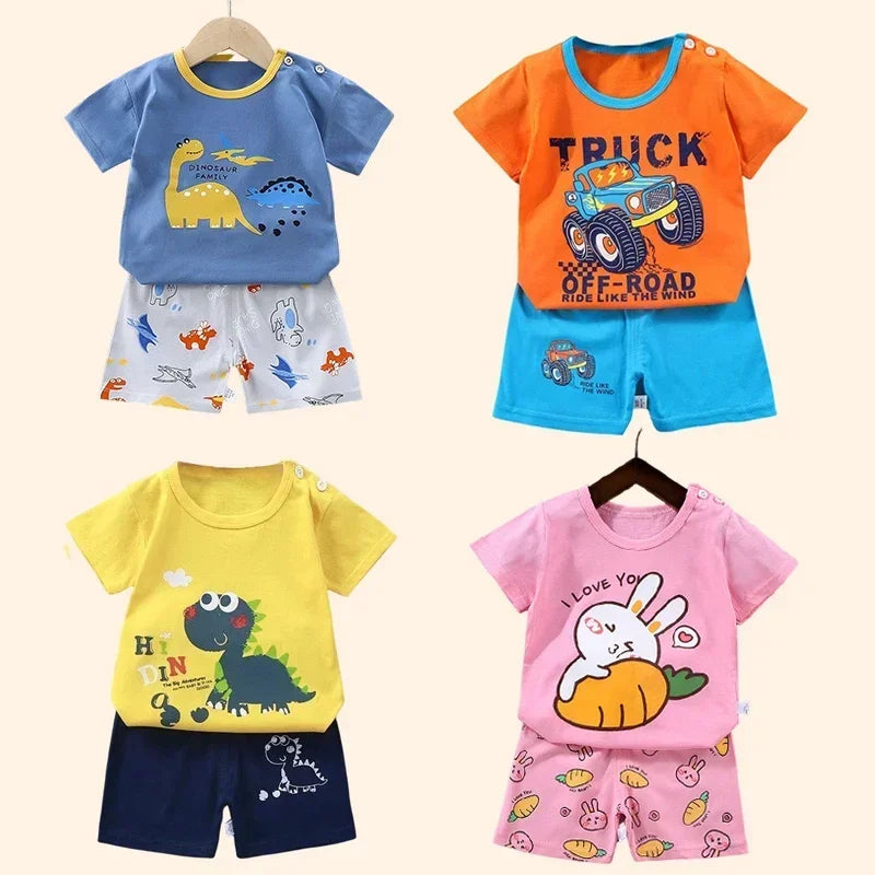 Four children's outfits with different designs on a white background
