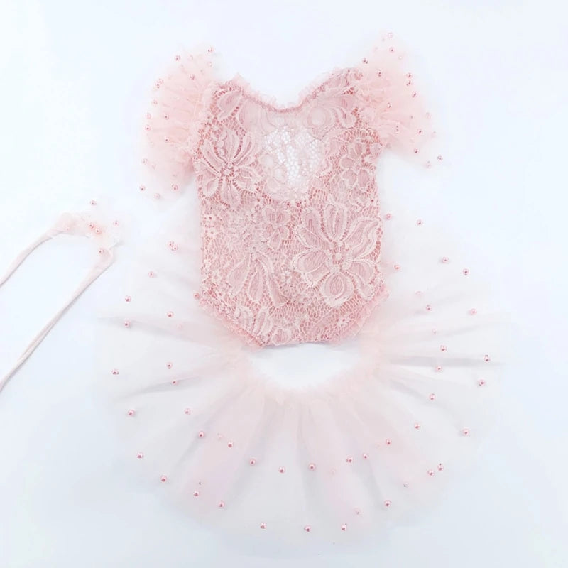Pink sequin top with white tulle skirt on a white background