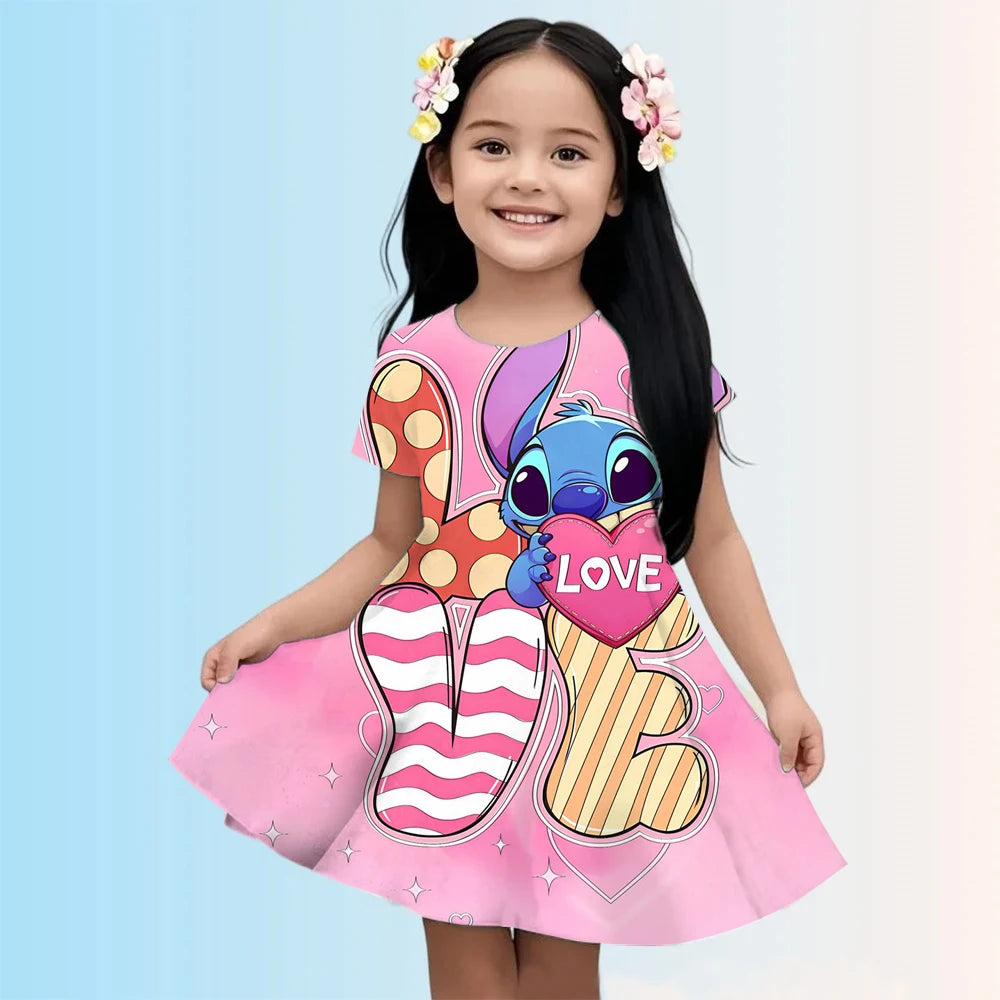 Child wearing a colorful dress with cartoon character design on a light blue background