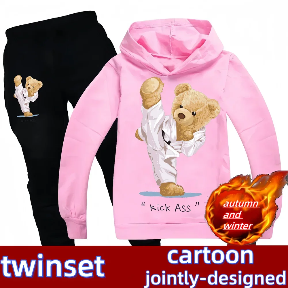 Pink hoodie with bear design and black pants with bear graphic, featuring 'twinset' branding.
