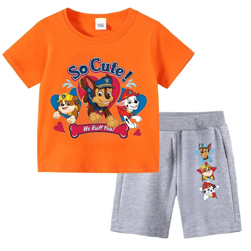 Children's outfit with orange t-shirt and gray shorts featuring cartoon characters on a white background