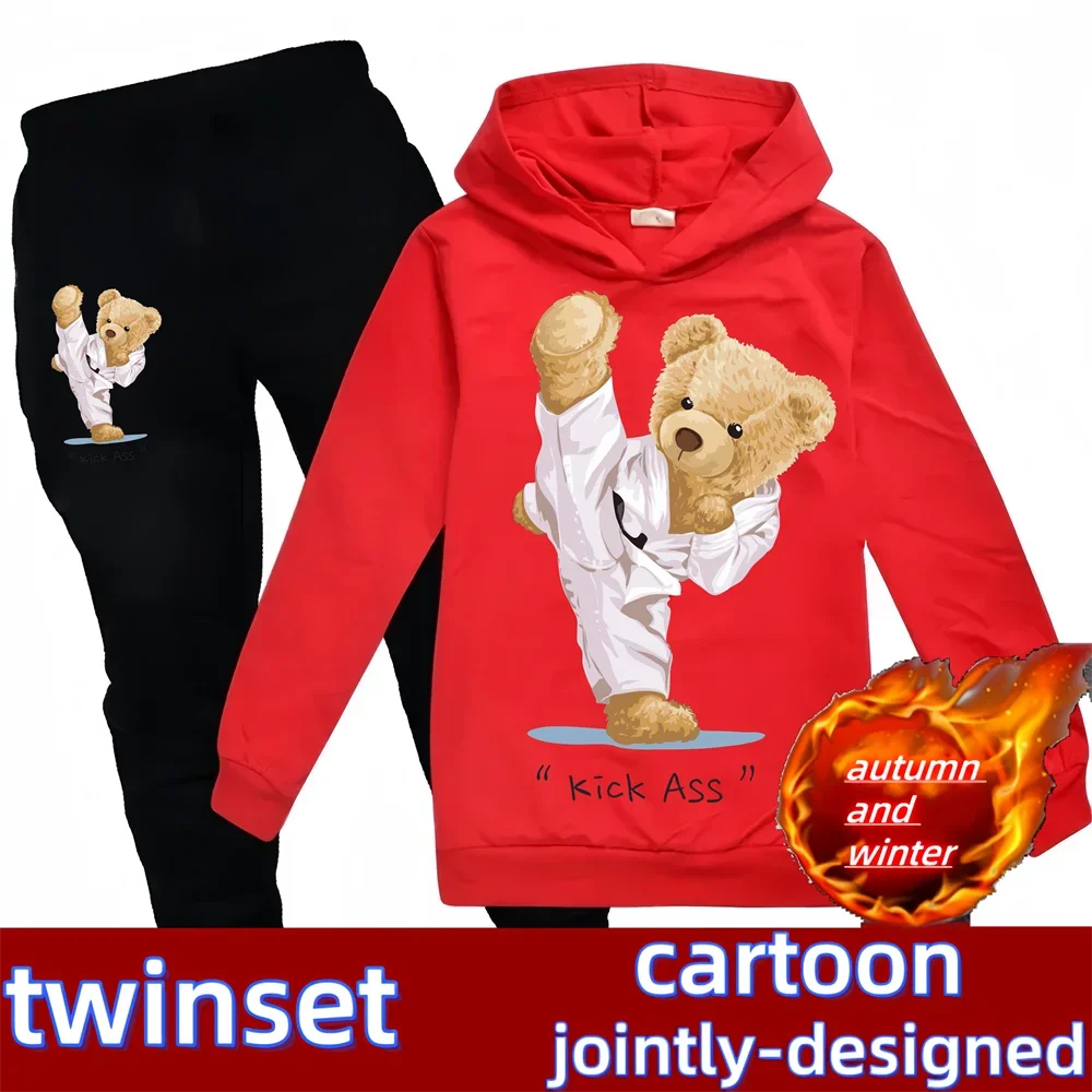 Red hoodie with cartoon bear design and black pants on a white background, featuring the brand 'twinset'.
