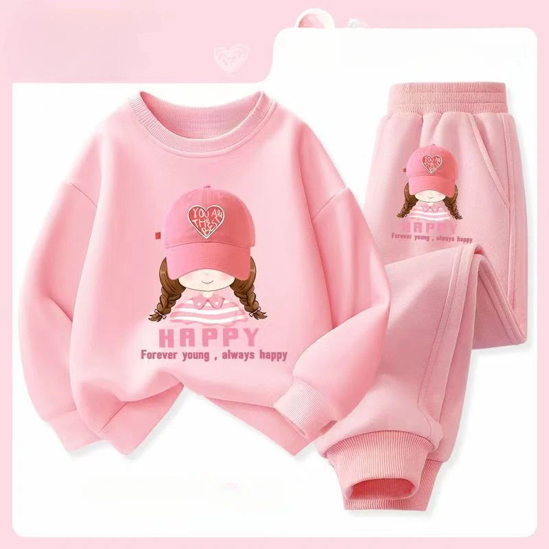 Pink children's outfit with matching hat on a white background