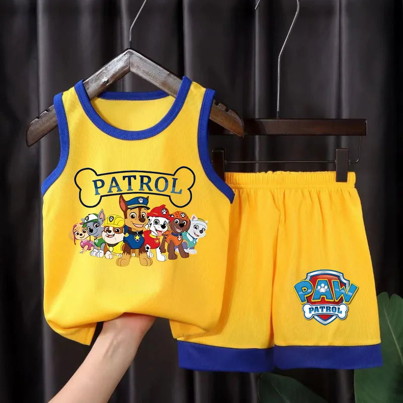 Yellow 'Paw Patrol' children's sleeveless top and shorts set on a hanger against a dark background.