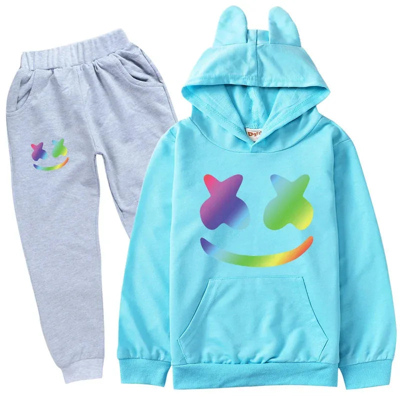 Children's outfit with blue hoodie and gray pants featuring colorful smiley face designs on a white background.
