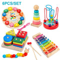Set of colorful wooden educational toys including a clock, stacking rings, and xylophone.