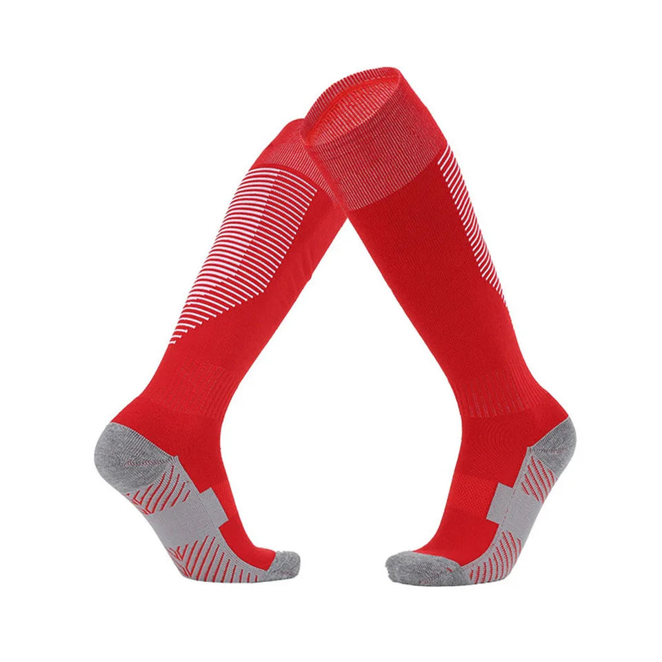 Red knee-high socks with gray toes and heels on a white background