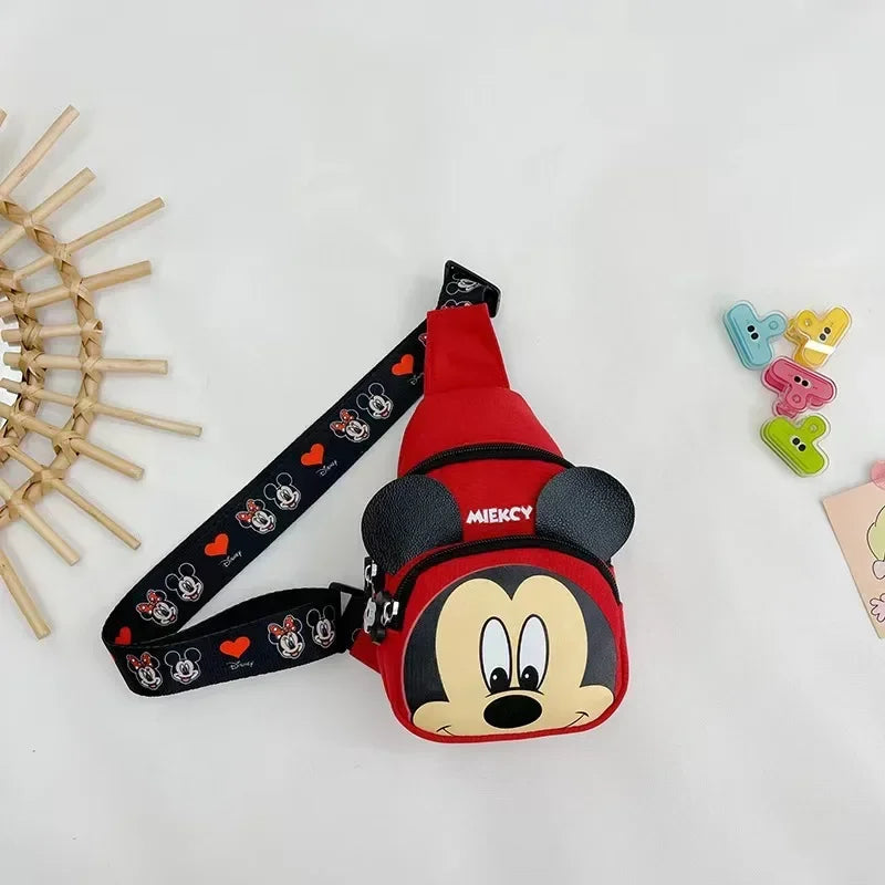 Mickey Mouse-themed red and black bag with a strap on a light gray background