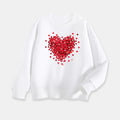 White sweatshirt with a red heart pattern on a white background