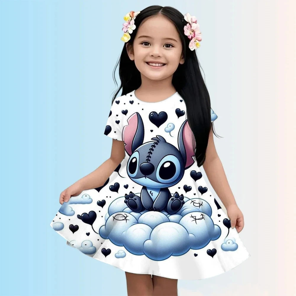 Child wearing a dress with cartoon character design against a light blue background
