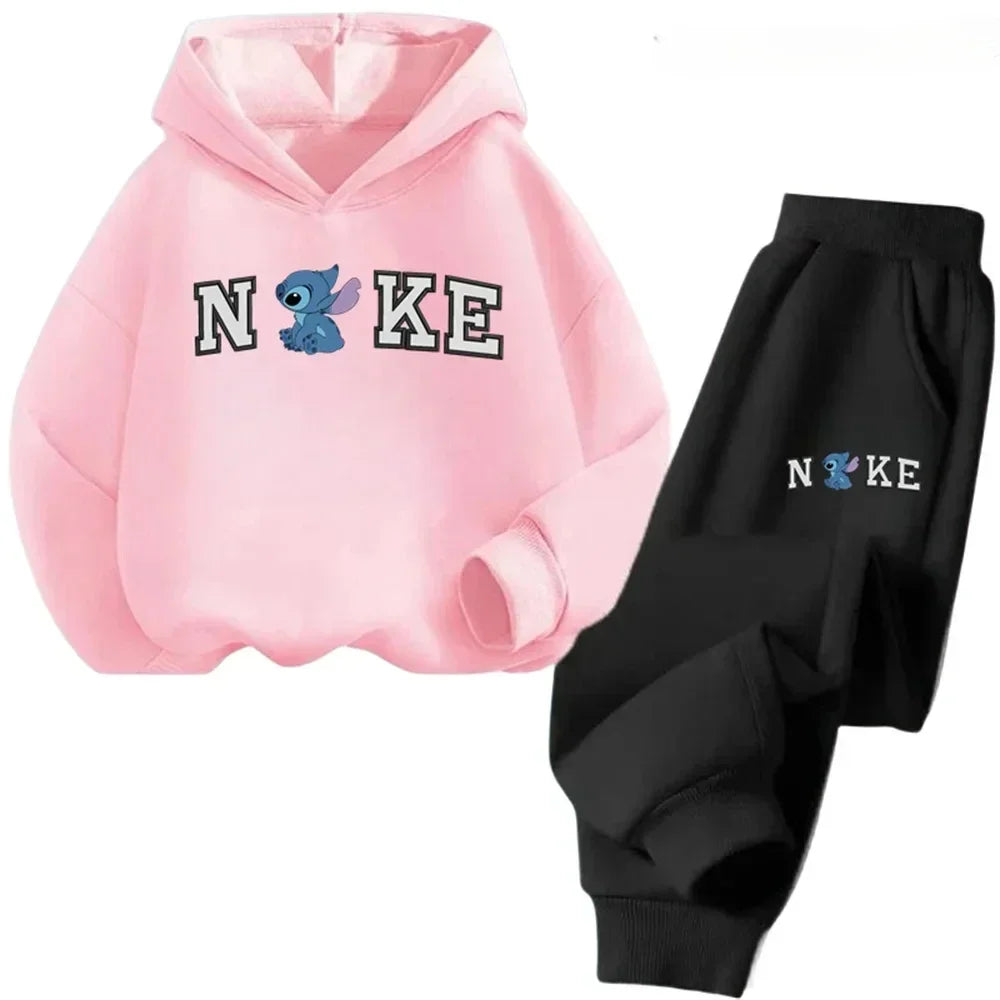 Pink hoodie and black pants with cartoon character design on a white background