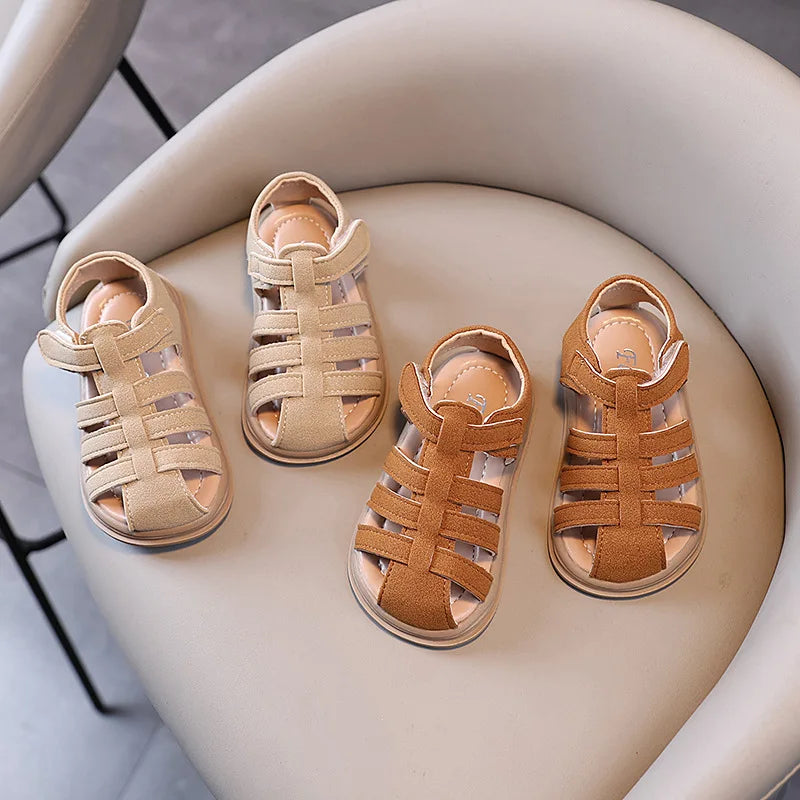 Pair of beige sandals and a pair of brown sandals on a white chair.