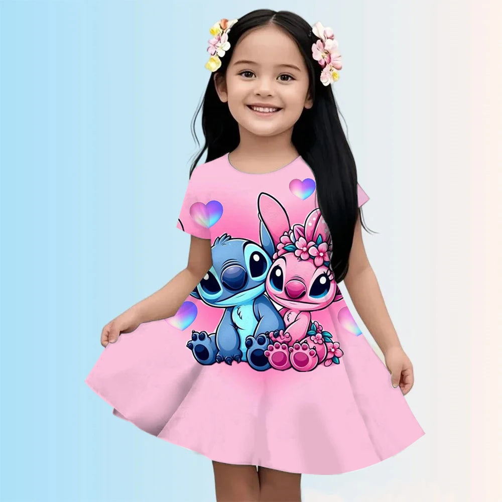 Child wearing a pink dress with cartoon characters on a light blue background