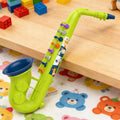 Toy saxophone with animal patterns on a wooden surface and colorful mat