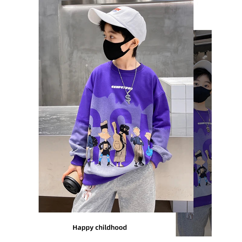 Person wearing a purple sweatshirt with graphic designs and text, holding a camera.