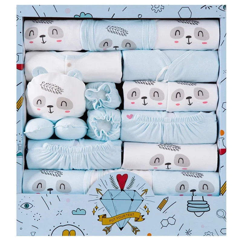 Set of baby clothes with animal designs in a decorative box