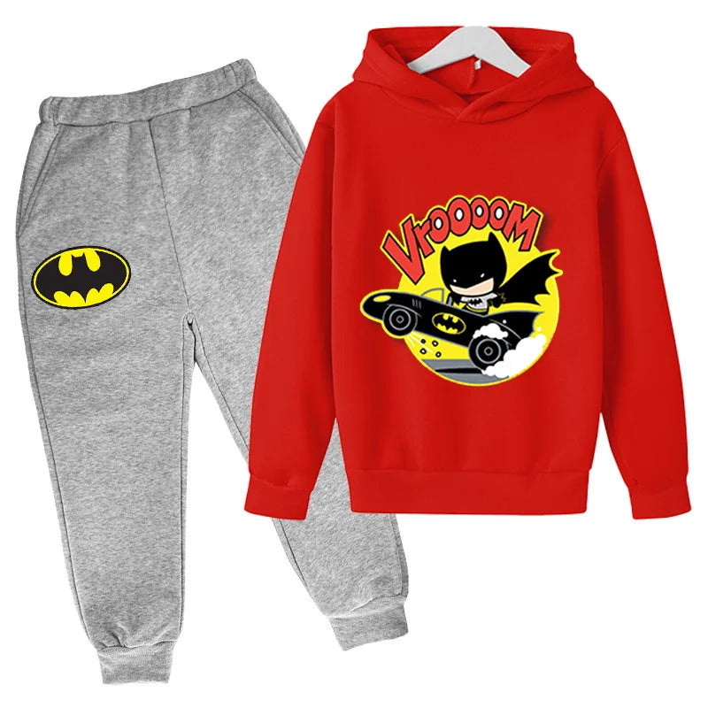 Red hoodie with cartoon design and gray sweatpants with Batman logo on a white background