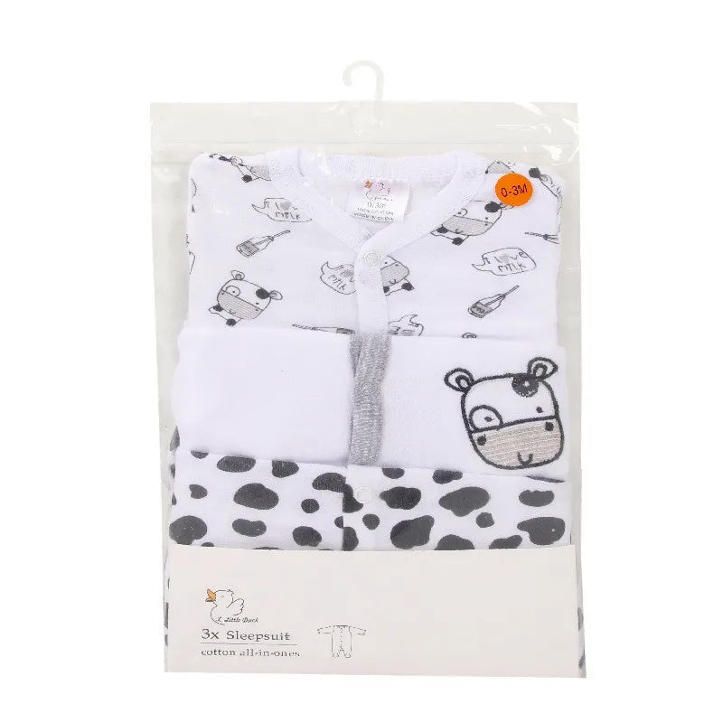 Pack of baby sleepwear with cartoon designs on a white background